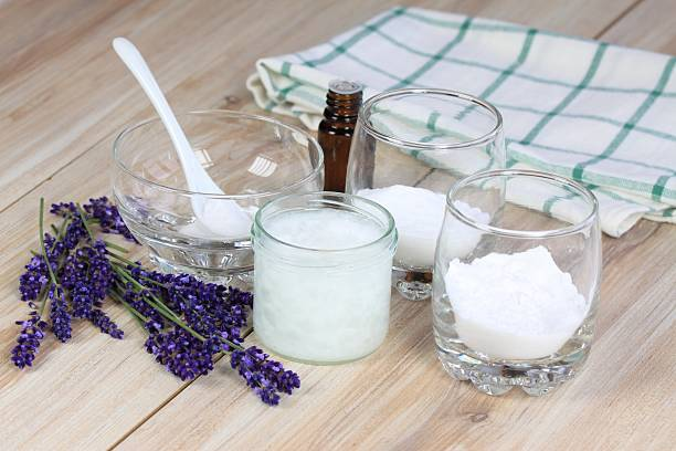 Ingredients for homemade natural deodorant, including baking soda, coconut oil, essential oil, and lavender&nbsp;